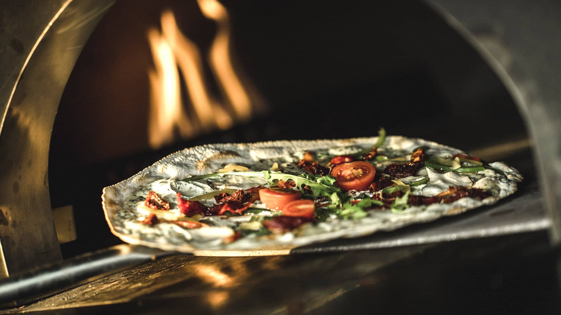 Die Spezialität des Hauses: Köstlich belegte Flammkuchen-Variationen frisch aus dem Ofen!